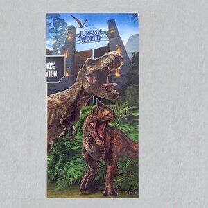Jurassic World Epic Convos Beach Towel measures 28 x 58 inches